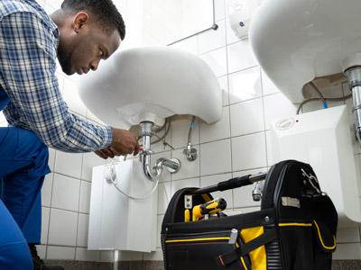 contractor working on sink